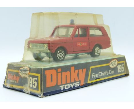 Dinky Toys diecast model Fire Chief's Car with red body, blue windows and Fire Service decals, 195, in original bubble packed