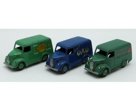 Three Dinky Toys diecast model Trojan delivery vans Beefy Oxo 31D, Chivers Jellies 452 and Cydrax 454.&nbsp;