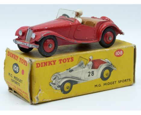 Dinky Toys diecast model M.G. Midget Sports with red body and hubs, beige driver and brown interior,108, in original box.