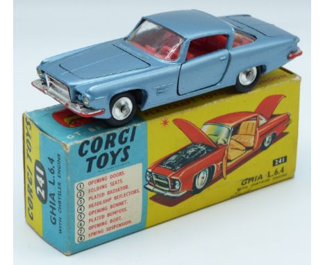 Corgi Toys diecast model Ghia L6.4 with Chrysler engine blue body, red interior, silver hubs, Corgi dog to parcel shelf and o