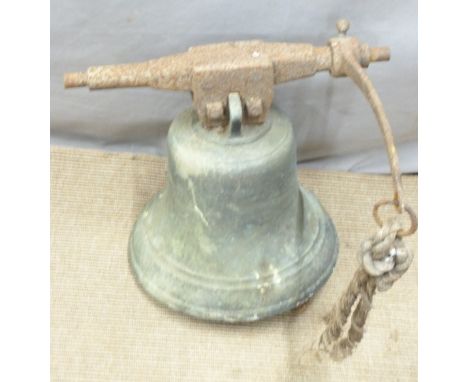 A large 19thC bronze bell attached to a cast metal suspension bar with rope pull attachment. We are advised by the vendor tha