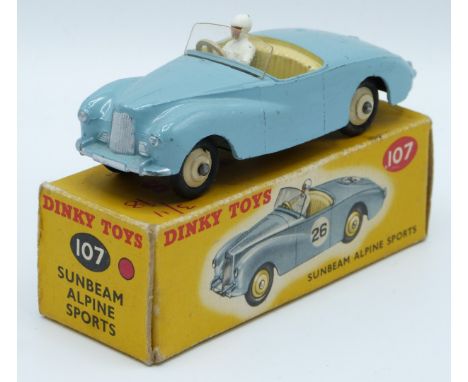 Dinky Toys diecast model Sunbeam Alpine Sports with blue body, white driver, beige interior and hubs, 107, in original box.