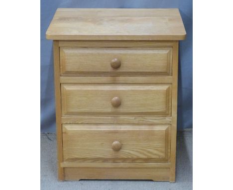 A contemporary light oak bedside chest of three graduated drawers and a dressing table mirror, W49 x D44 x H57cm&nbsp;