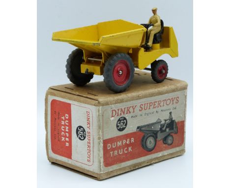 Dinky Supertoys diecast model Dumper Truck with yellow body, red hubs and beige driver, 562, in original box.&nbsp;