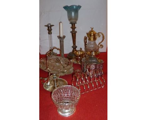 A QUANTITY OF SILVER PLATE includes; toast rack, chamber stick with snuffer, caddy, candlesticks etc. 