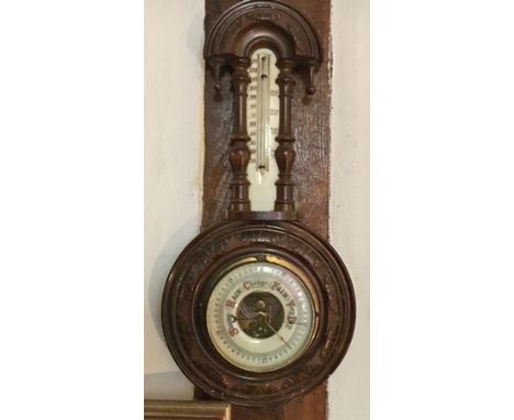A SMALL STAINED WOOD FRAMED WALL BAROMETER with thermometer 