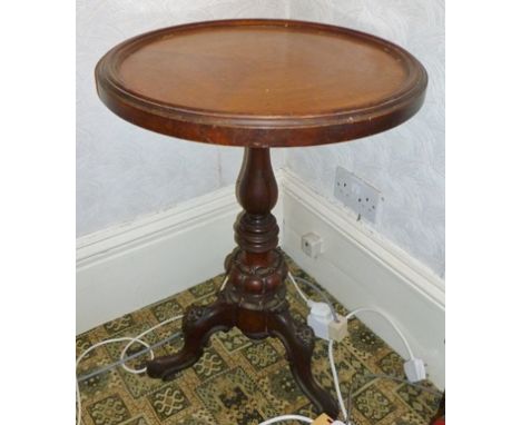 A LATE VICTORIAN MAHOGANY OCCASIONAL WINE TABLE with dish top, on turned and carved stem with tripod supports and scroll toes