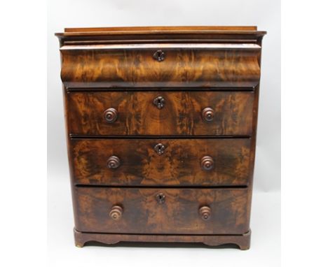A 19TH CENTURY MAHOGANY CHEST OF DRAWERS with cushion fronted frieze drawer over three below, with turned knob handles 