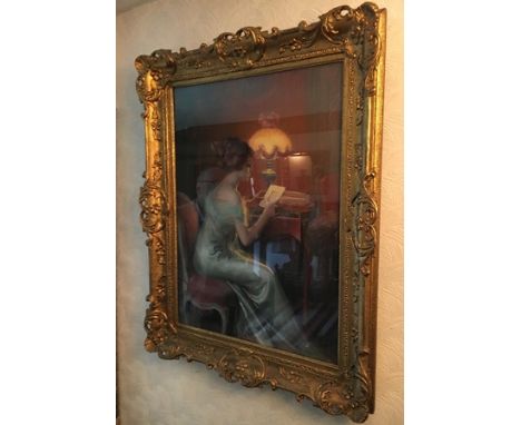 EUROPEAN SCHOOL - PASTEL DRAWING of an Edwardian lady at her desk studying an image in the light of her lamp, indistinctly si