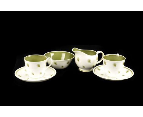 A Susie Cooper 'Whispering Grass' six piece tea service, including tea cups, saucers, plats, cream and sugar bowl