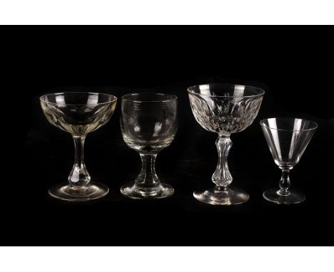 A collection of 19th century drinking glasses,  to include toasting glasses, champagne saucers, and other pieces