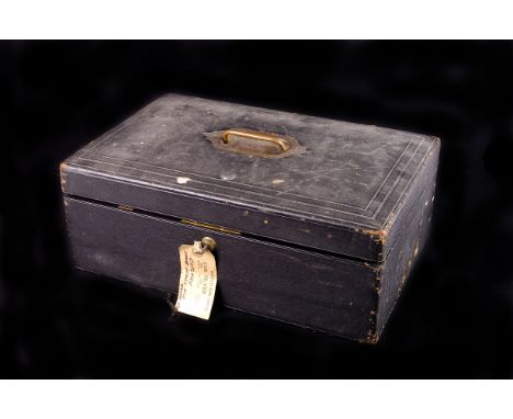 A Victorian 'Parkins & Gotto' black leather travelling case,    with removable upper shelf compartment, Bramah lock, 41cm lon