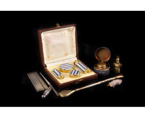 A 19th century leather cased miniature travelling inkwell, together with an Art Deco MOP vanity set, a silver cased comb, a m