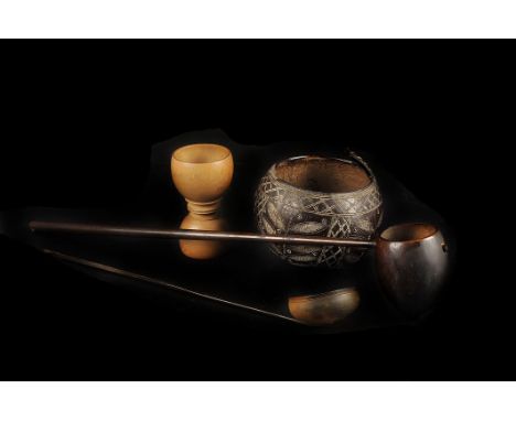 A carved coconut drinking vessel,  together with a horn ladle, and two other wooden vessels