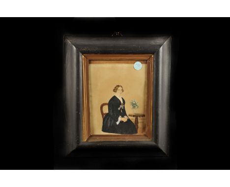 A Victorian watercolour portrait,  of a woman seated, 17 x 23cm, in a painted wooden frame, AF
