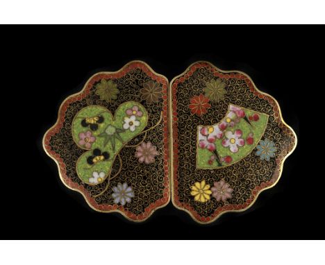 A Chinese cloisonné enamel buckle, with flower and scroll motif overall, 7.8cm long