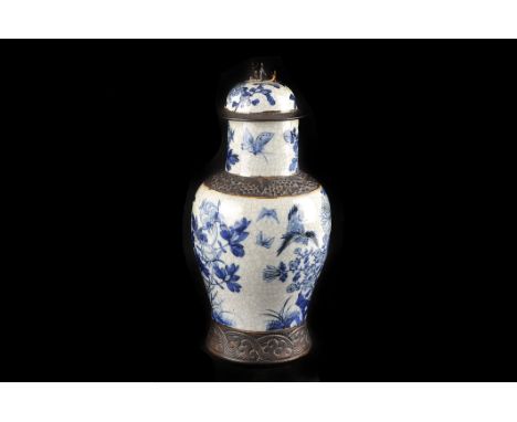 A Chinese blue and white crackle ware vase,  decorated with birds and flowers, bronzed borders, the high neck to a  domed cov