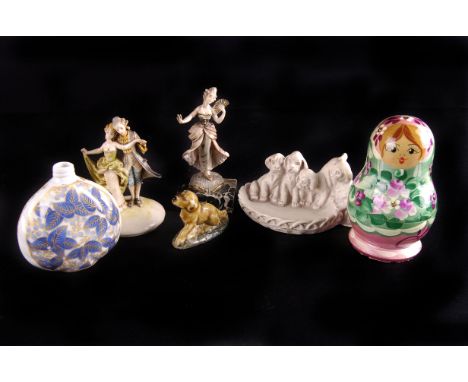 A collection of miscellaneous ornaments,  including a wooden Russian doll, ceramic animals, costume jewels, and other items (