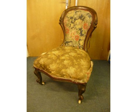 A Victorian stained beech spoon back chair,  on cabriole legs, to porcelain casters