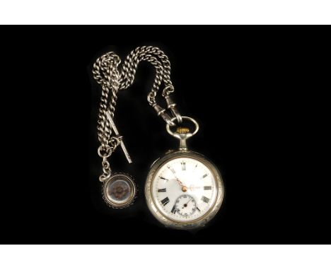 A late 19th century Continental white metal open faced pocket watch,  the reverse of the case chased with stylised flowers,  