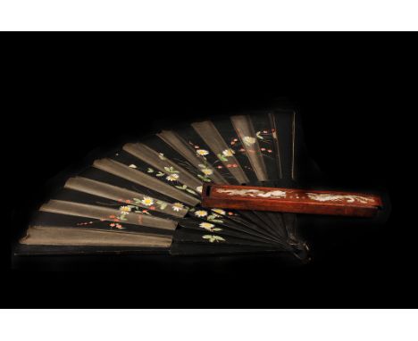 A faux tortoiseshell and paste set hair comb,  together with a collection of feathers, a painted black lacquer fan, and a box