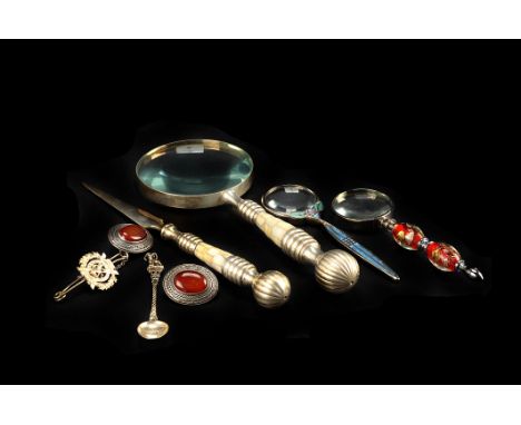 A group of silver items,  including a pair of carnelian style set clip earrings, an 800 standard souvenir spoon, and a regime