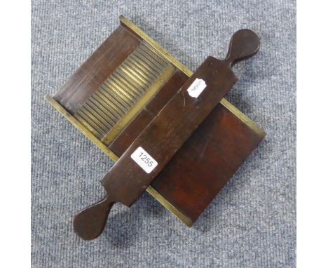 A George III brass and mahogany pill roller 