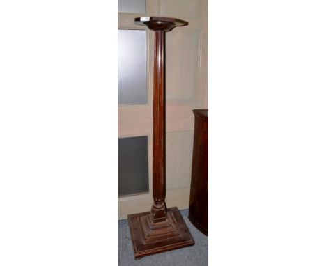 ~ A large mahogany plant pedestal, late 19th / early 20th century, with octagonal platform top above a fluted support and a s