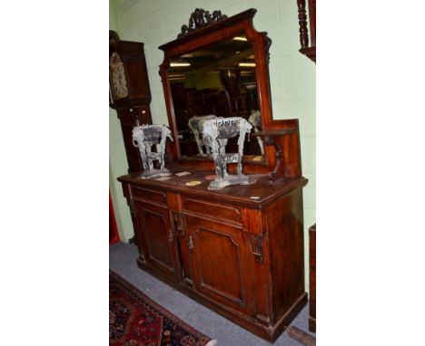 ~ A late Victorian mahogany mirror back sideboard, circa 1880, the superstructure back with scroll bracket supports, the base