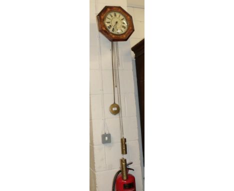 ~ A Victorian inlaid octagonal postman's alarm clock, painted wooden Roman dial, with two weights and pendulum, 35cm diameter