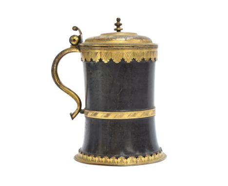 A rare early 17th century Saxony gilt copper mounted serpentine tankard, c.1600, the tapered smooth banded body with gilt cop