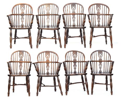 A well matched set of eight good 19th century yew and elm low back Windsor armchairs, c.1840, seven stamped 'E. Gabbitass, Wo