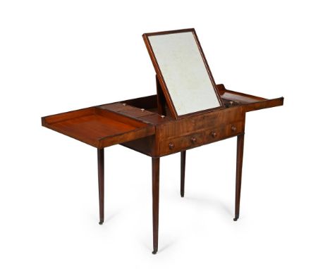 A George III mahogany and crossbanded dressing table, c.1800, the twin hinged top opening to an arrangement of lidded compart