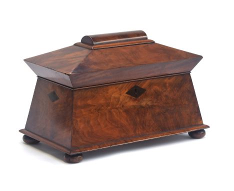A Victorian mahogany sarcophagus form tea caddy, tablet top, opening to two canisters and a glass sugar bowl, 38cm wide, 22.5
