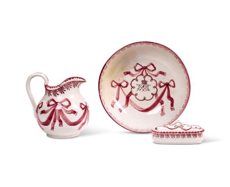 A late 19th century Wemyss pottery part wash set, decorated in puce and with an Earl's coronet above a monogram, comprising: 