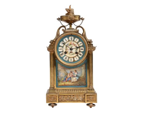 A late 19th century French gilt metal and Sevres style porcelain inset mantel clock, with French eight-day bell striking move
