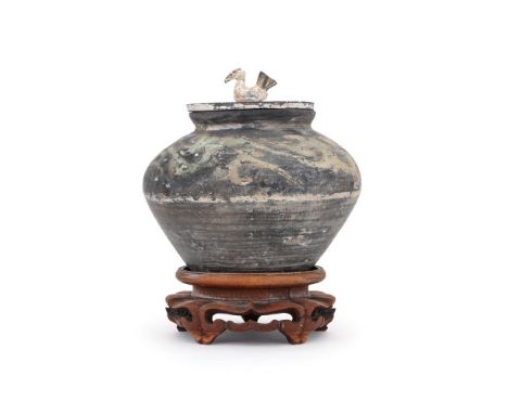 A Chinese Han Dynasty painted pottery vase and cover, decorated with red, white and green pigments and painted with stylised 