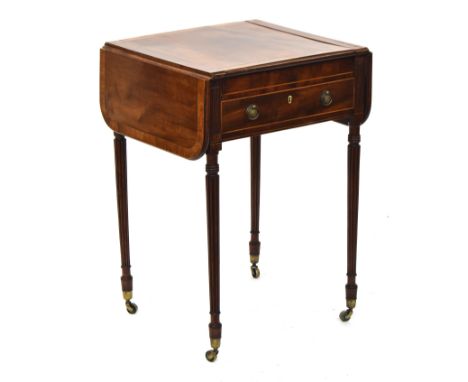 A Regency mahogany and crossbanded Pembroke games table, c.1815, with reversable chessboard top sliding to reveal a backgammo