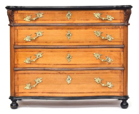 A continental serpentine commode chest, 20th century, the top with ebonised moulded edge over four graduating crossbanded dra