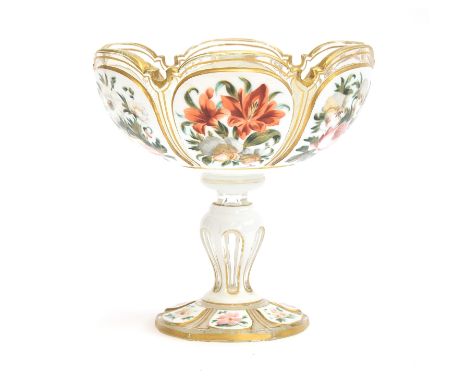 A 19th century Bohemian overlaid glass bonbon dish, painted with polychrome panels of flowers, heightened in gilt, 16cm diame