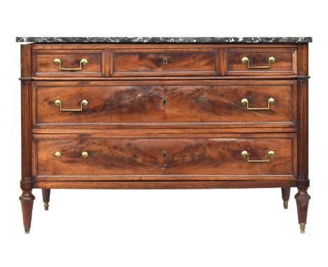 A Louis XVI mahogany commode, late 18th century, the marble top over three short and two long drawers, flanked by fluted colu
