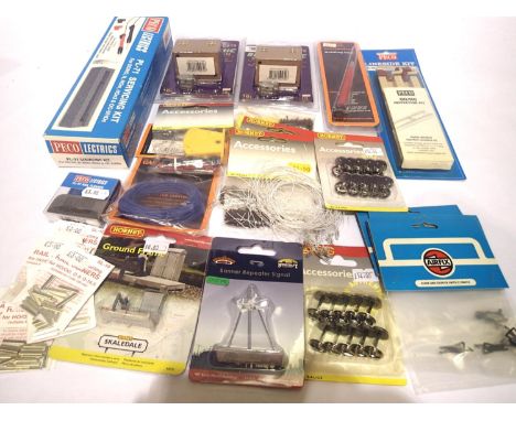 Selection of accessories including servicing kit, inspection pit, track pins, wheels, fishplates, LEDs, switches, Dapol sound