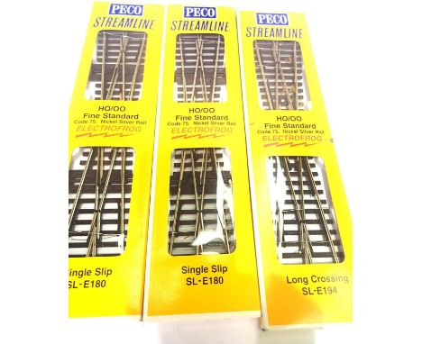 Two Peco firescale SL-E180 single slip, electrofrog, code 75 rail and SLE194 long crossing electrofrog, all new/packets. P&am