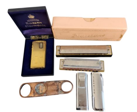 A Hohner Marine Band harmonica, A440;&nbsp; &nbsp;another;&nbsp; &nbsp;a Ronson Electronic lighter, boxed;&nbsp; &nbsp;cigar 
