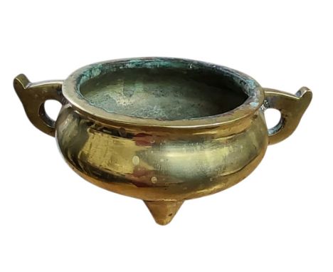 A Chinese bronze tripod ding censer, scroll handles, 17cm wide, probably 19th century