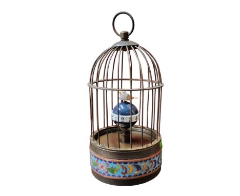 A novelty automaton clock, as a bird in a cage, cloisonne band, 21cm high
