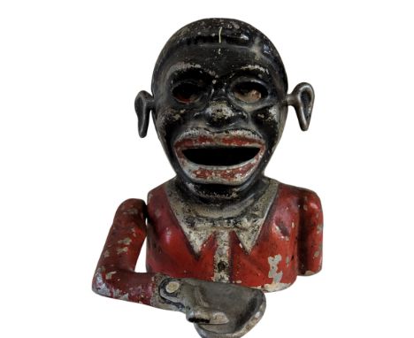 An early 20th century aluminum&nbsp; Jolly black man money bank, 16cm high, Starkies Patent;&nbsp; a Rosetti autoharp;&nbsp;&