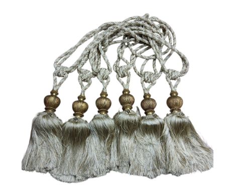 A set of six drapery/curtain tie-backs, in gold and cream