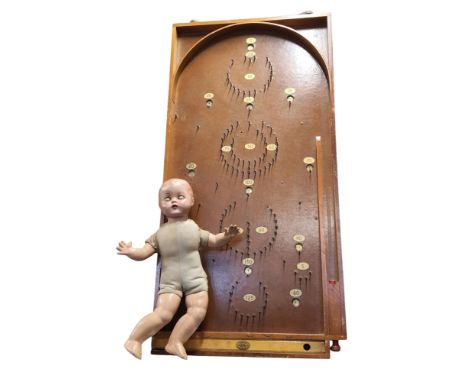 A Chad Valley bagatelle board, c.1940;&nbsp; a composite doll, sleeping eyes, moulded hair, cloth body, 35cm long, c.1940 (2)