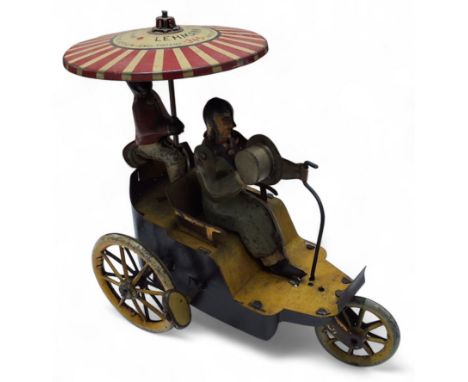 A Lehman Clockwork Tinplate New Century Cycle No.345, with blue and yellow tricycle, yellow spoked wheels, gentleman driver w